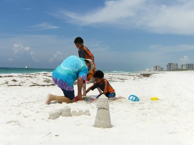 building sand castles with friends